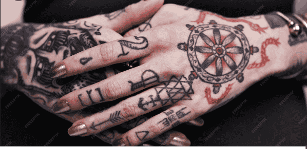 hand and fingers tattoo